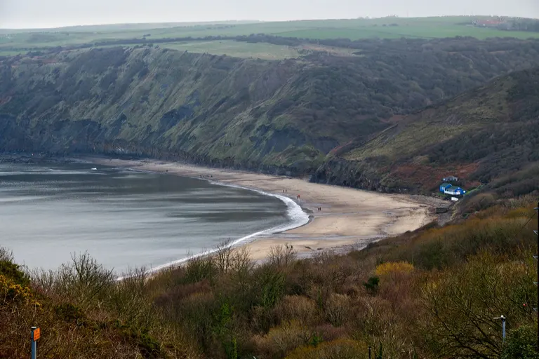 Photo of Runswick Bay, a swimming spot near Staithes in the North York Moors, North Yorkshire, northern England.