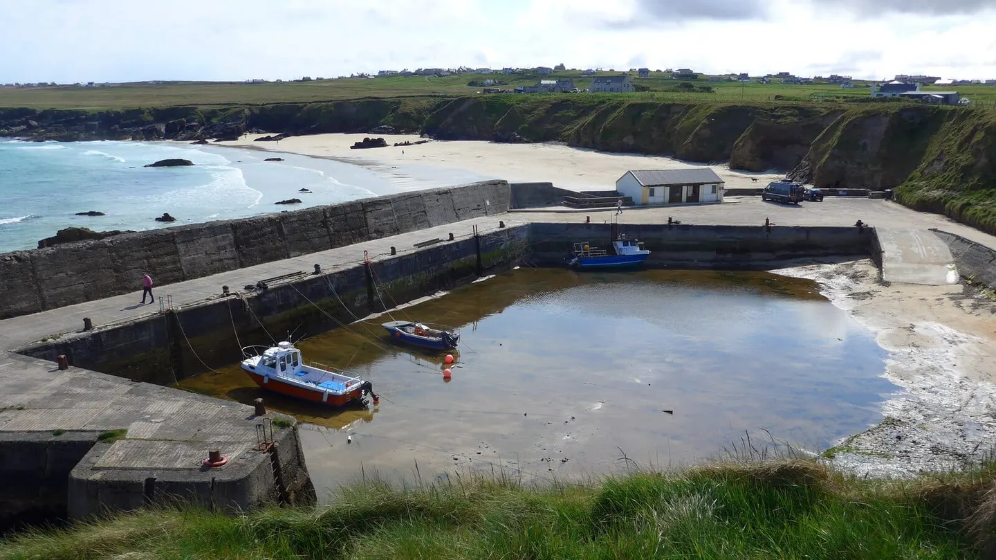 Photo of Port of Ness, a village in Na h-Eileanan Siar, the Scottish Highlands and Islands.
