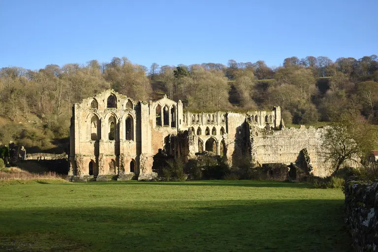 Photo of Rievaulx Abbey, a ruined abbey in the North York Moors, North Yorkshire, northern England.