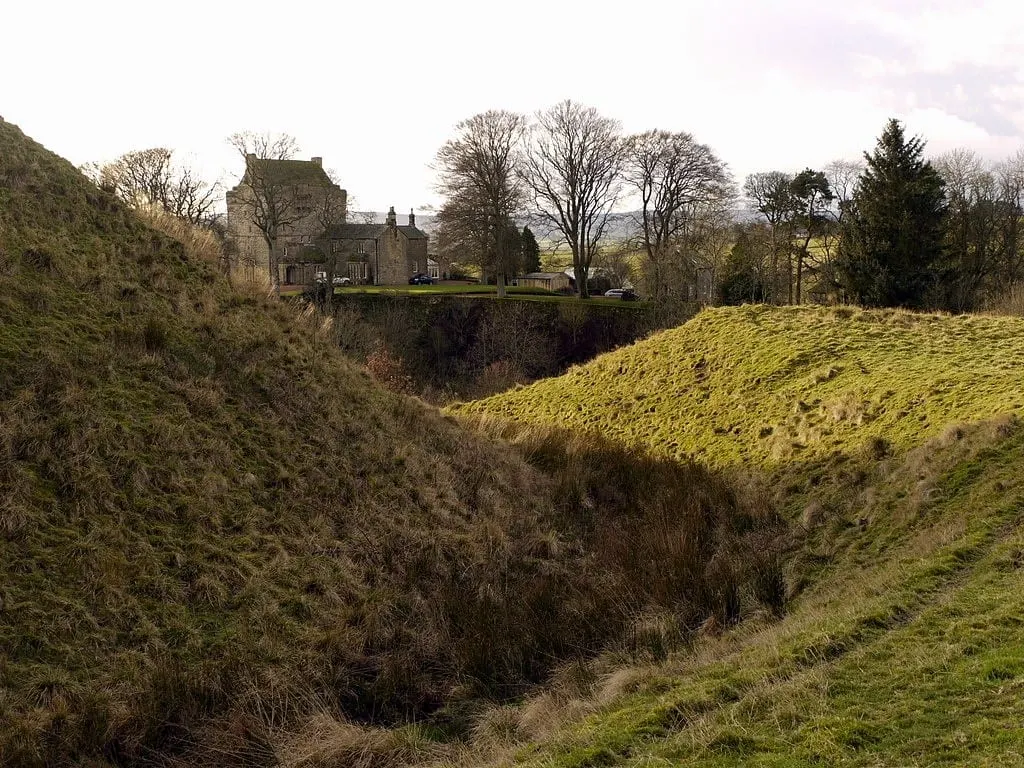 Photo of Mote Hills motte, the earthworks of a former castle near Elsdon, Northumberland, north east England.
