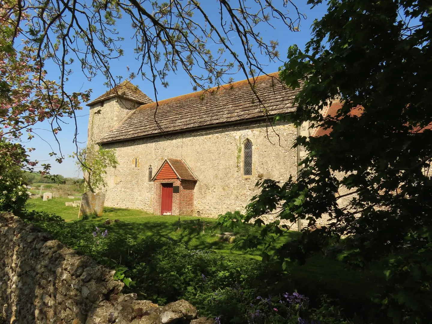 Photo of St Botolph's, Botolphs, a church in the South Downs, West Sussex, south east England.