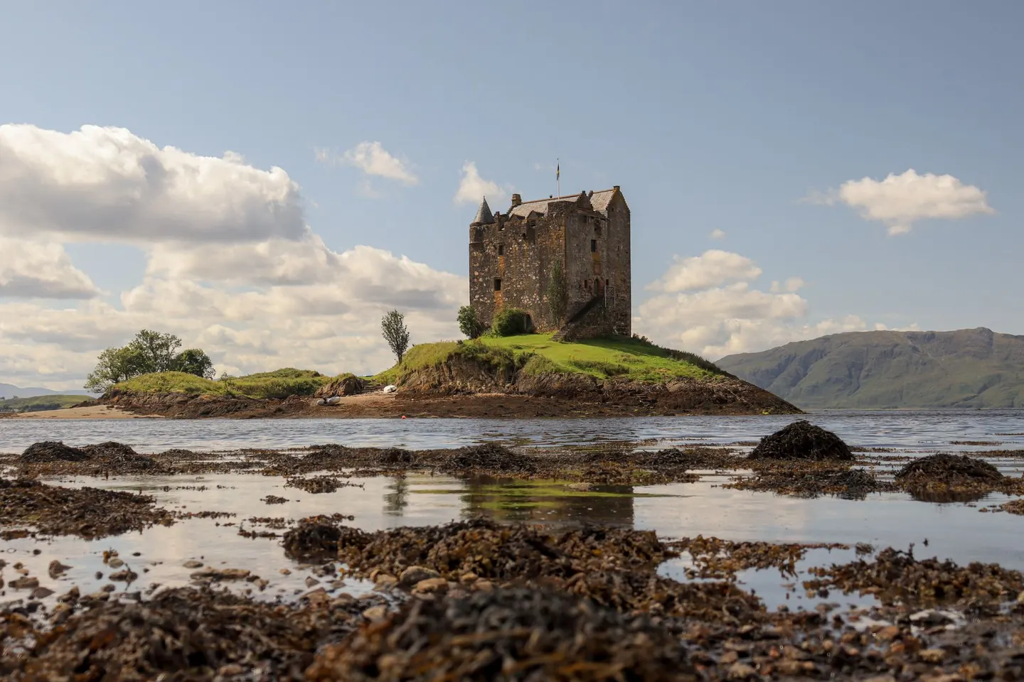 Photo of Castle Stalker, a tower house near Port Appin in the Lynn of Lorn, Argyll and Bute, the Scottish Highlands and Islands.