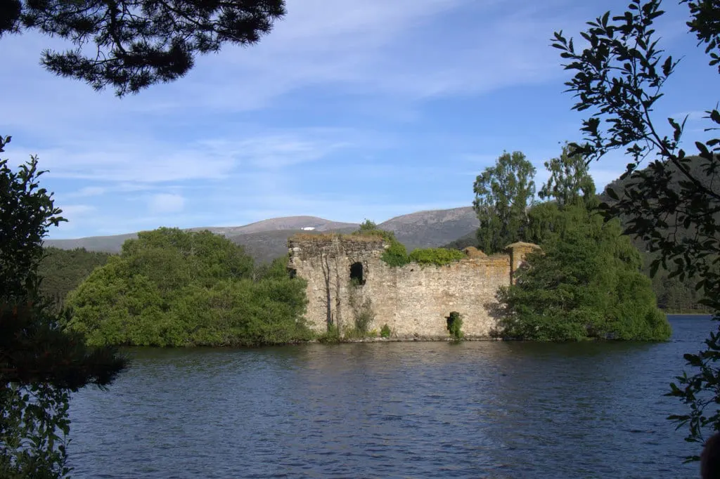 Photo of Loch an Eilein Castle, a ruined castle near Aviemore in the Cairngorms, Highland, the Scottish Highlands and Islands.