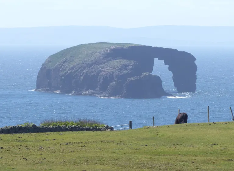 Photo of Dore Holm, a visitor attraction near Hillswick in Shetland, the Shetland Islands, the Scottish Highlands and Islands.