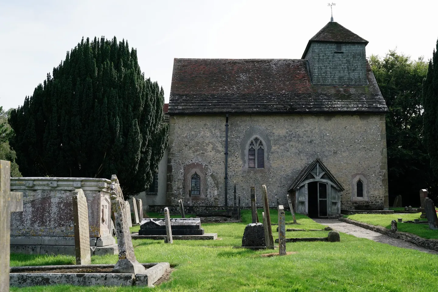 Photo of St John the Baptist, Clayton, a church in the South Downs, West Sussex, south east England.