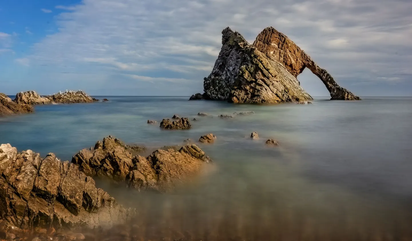Photo of Bow Fiddle Rock, a rock formation near Portknockie, Moray, the Scottish Highlands and Islands.