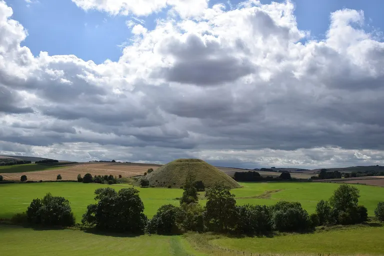 Photo of Silbury Hill, a prehistoric mound near Avebury in the North Wessex Downs, Wiltshire, south west England.