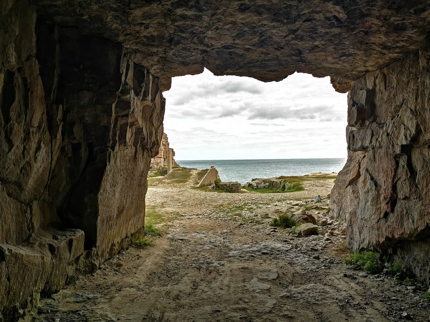 Photo of Winspit Quarry, a cave near Worth Matravers, Dorset, south west England.