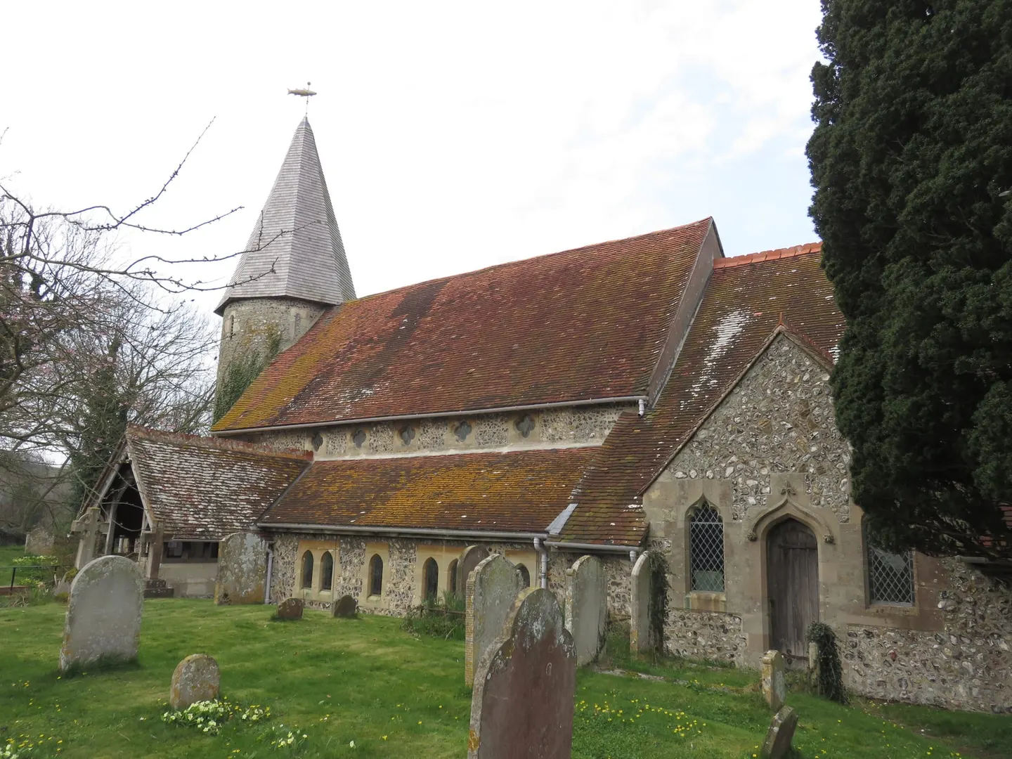Photo of St John the Evangelist, a church near Piddinghoe in the South Downs, East Sussex, south east England.