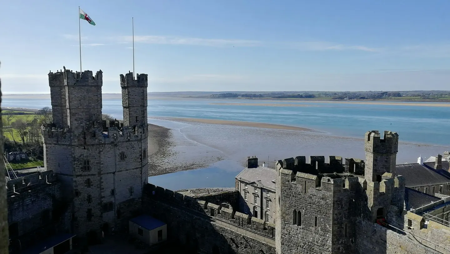 Photo of Caernarfon Castle, a ruined castle near Newborough, Gwynedd, north Wales.