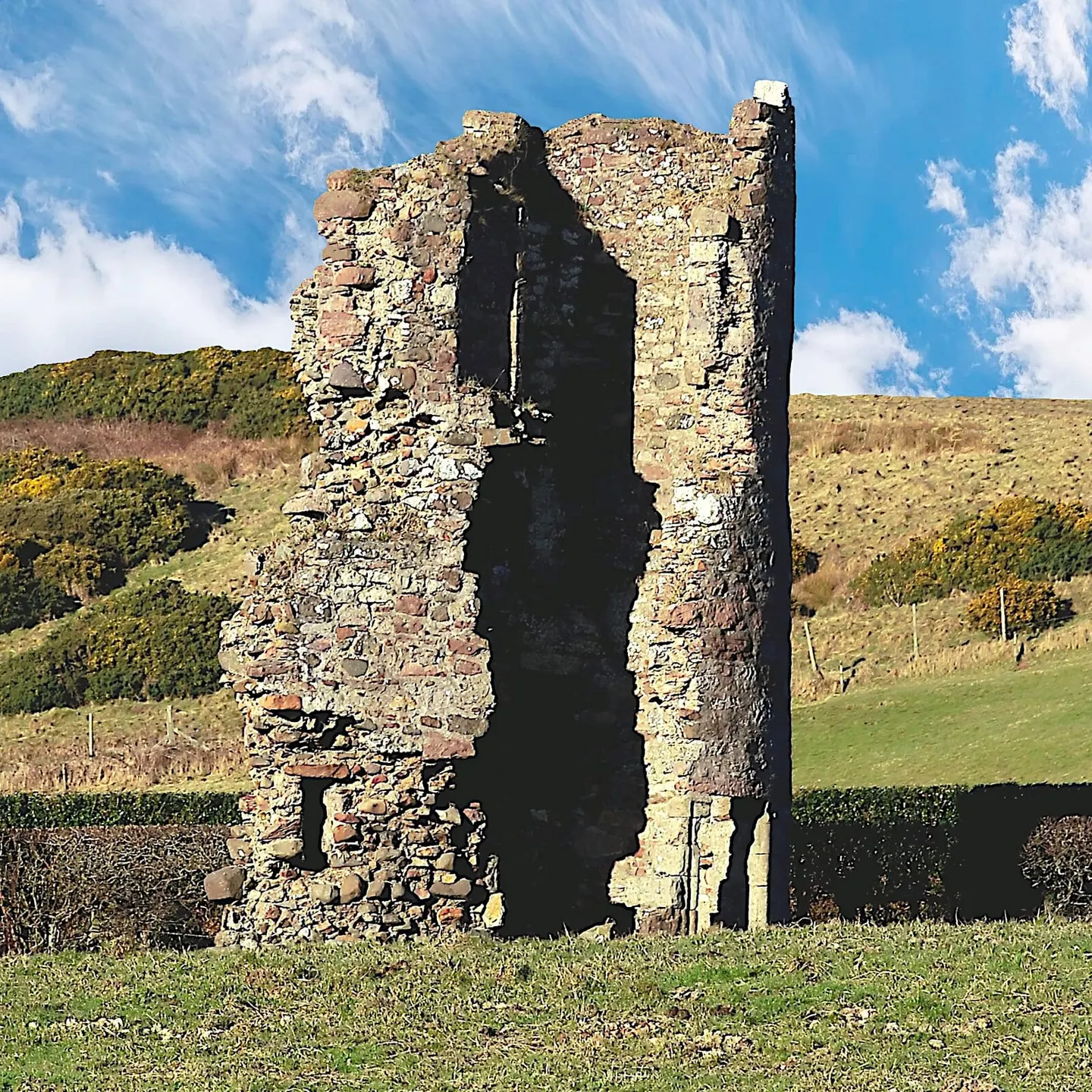Photo of Montfode Castle, a ruined castle near West Kilbride, North Ayrshire, southern Scotland.