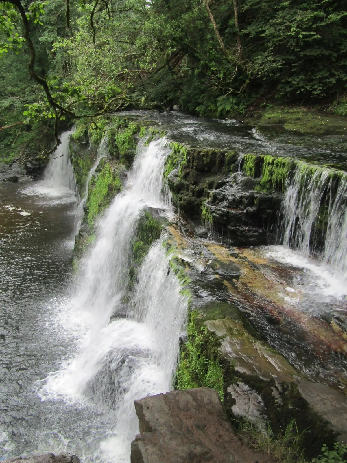 Photo of Sgwd Isaf Clun-gwyn, a waterfall near Ystradfellte in Bannau Brycheiniog, the Powys, mid Wales.