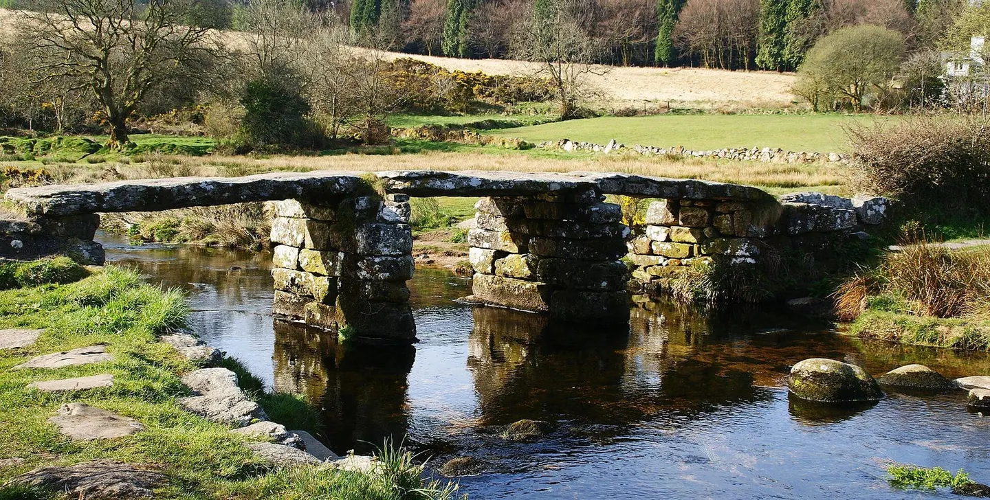 Photo of Postbridge Clapper Bridge, a landmark in Dartmoor, Devon, south west England.