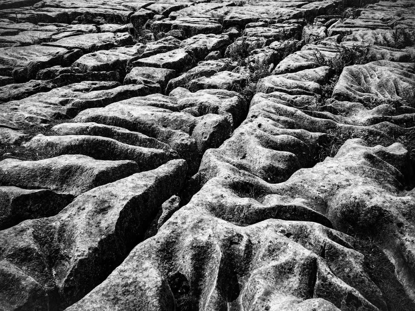 Photo of Malham Cove, a rock formation in the Yorkshire Dales, North Yorkshire, northern England.