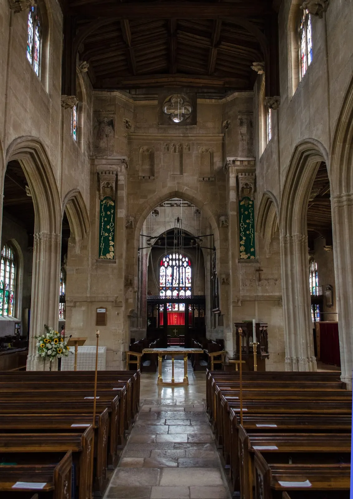 Photo of St Mary's Church, Fairford, Gloucestershire — Inside, looking down the nave.