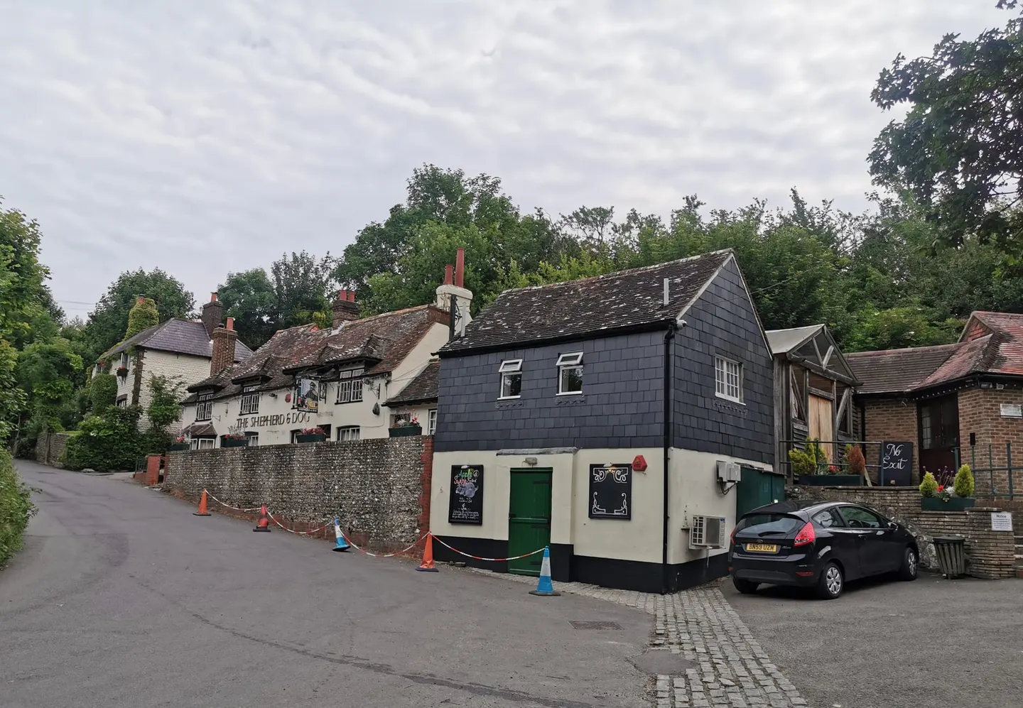 Photo of The Shepherd & Dog, a pub near Fulking in the South Downs, West Sussex, south east England.