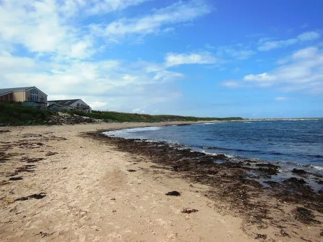 Photo of Beadnell Bay, a beach in Northumberland, north east England.