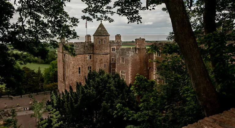 Photo of Dunster Castle, a motte & bailey in Exmoor, Somerset, south west England.