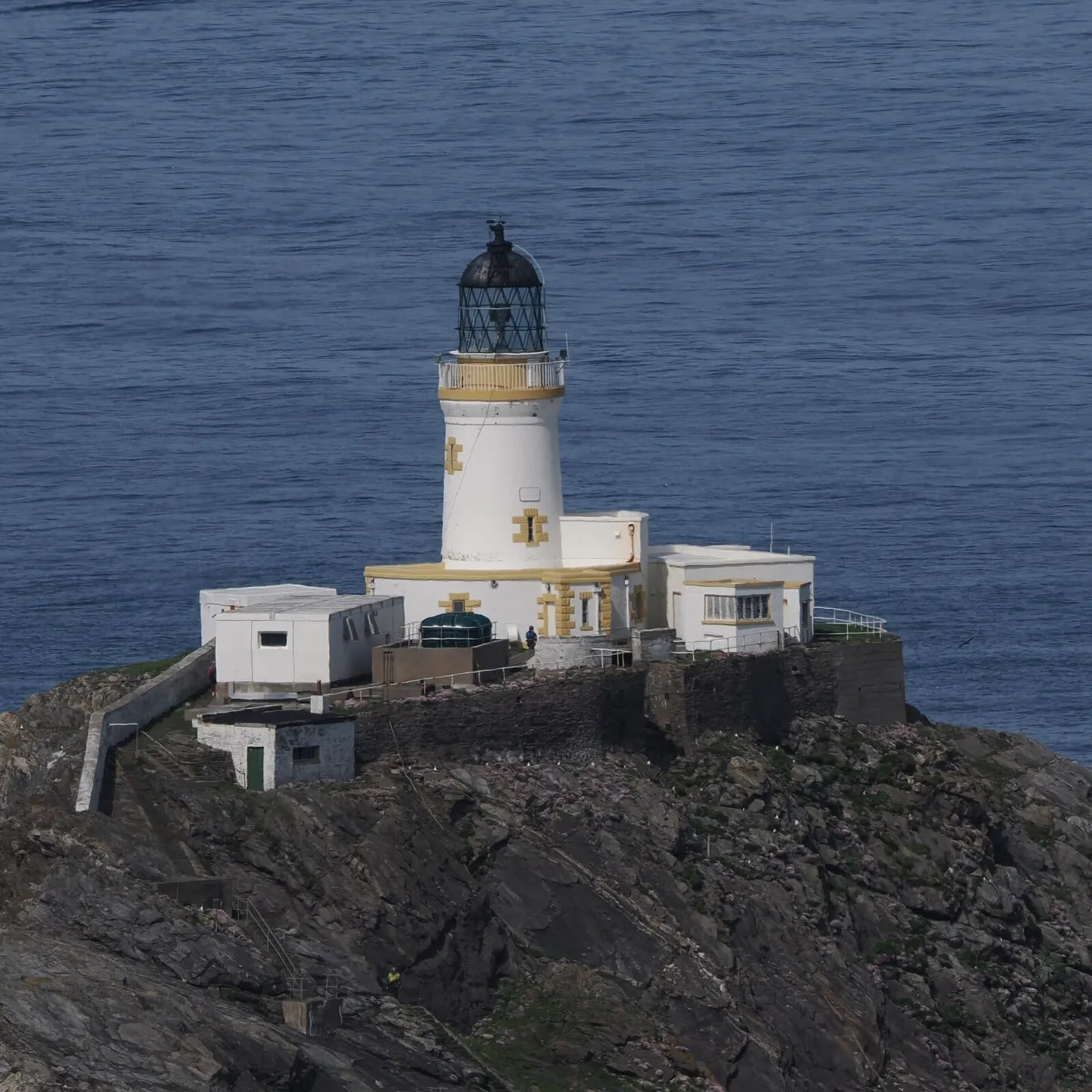 Photo of Muckle Flugga Lighthouse, a lighthouse near Haroldswick in Shetland, the Shetland Islands, the Scottish Highlands and Islands.