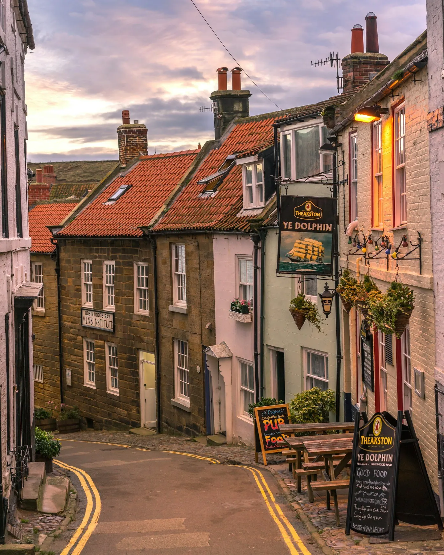 Photo of Robin Hood's Bay, North Yorkshire — Ye Dolphin pub at dusk, beside the old Men's Institute in the lanes of the old village.