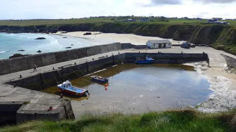 Photo of Port of Ness, a village in Na h-Eileanan Siar, the Scottish Highlands and Islands.