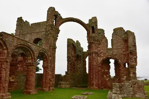 Photo of Lindisfarne Priory, a ruined priory near Holy Island (Lindisfarne), Northumberland, north east England.