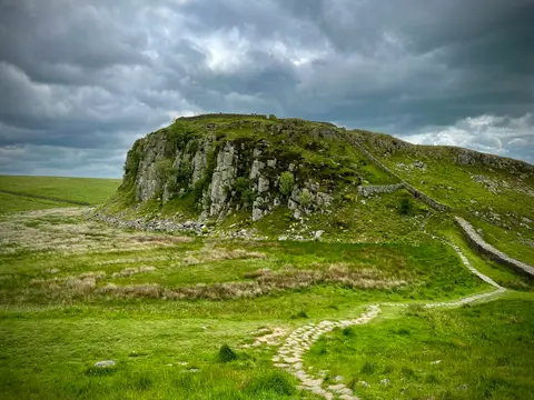 Photo of Sycamore Gap, a landmark near Bardon Mill, Northumberland, north east England.