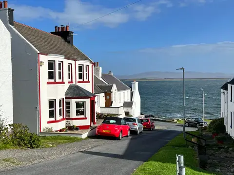Photo of Port Charlotte, a village in Argyll and Bute, the Scottish Highlands and Islands.