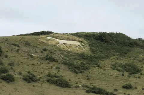 Photo of Litlington White Horse, a hill figure near Westdean in the South Downs, East Sussex, south east England.