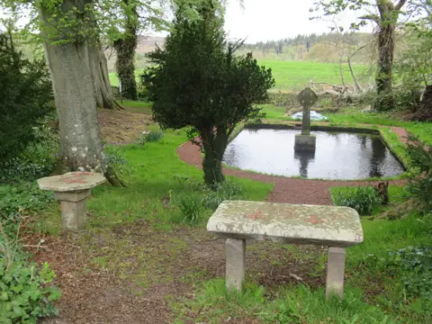 Photo of Lady's Well, a Roman archaeological site near Holystone, Northumberland, north east England.