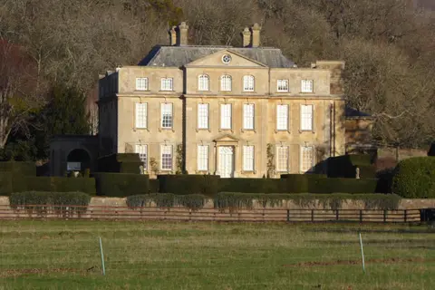 Photo of Overbury Court, a Grade II* registered house & garden near Bredon in the Cotswolds, Worcestershire, central England.