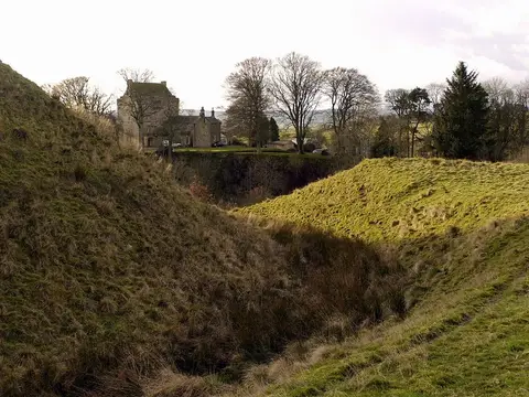 Photo of Mote Hills motte, the earthworks of a former castle near Elsdon, Northumberland, north east England.