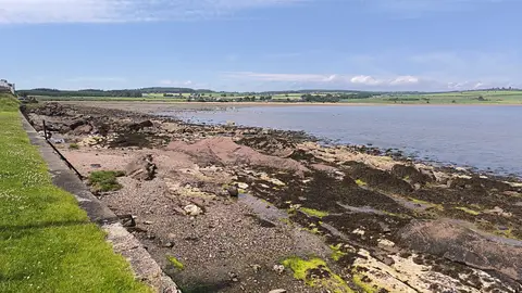 Photo of Kilchattan Bay, a village in Argyll and Bute, the Scottish Highlands and Islands.