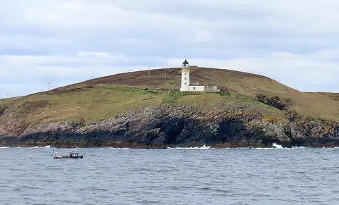Photo of Tiumpan Head Lighthouse, a lighthouse near North Tolsta, Na h-Eileanan Siar, the Scottish Highlands and Islands.