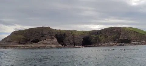 Photo of Cullykhan Bay, a beach near Pennan, Aberdeenshire, north east Scotland.