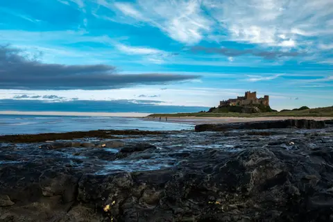Photo of Bamburgh Beach, a swimming spot in Northumberland, north east England.