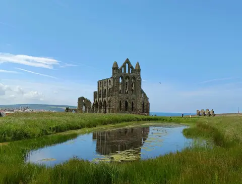 Photo of Whitby Abbey, a ruined monastery in North Yorkshire, northern England.