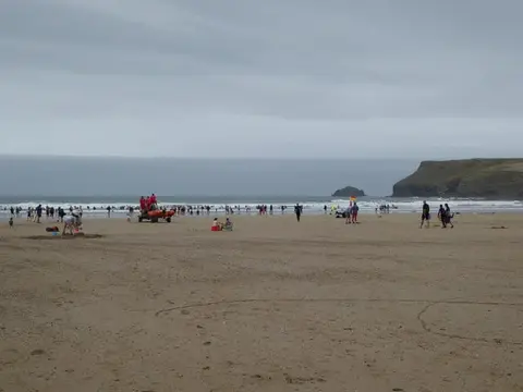 Photo of Polzeath, a swimming spot near Padstow, Cornwall, south west England.