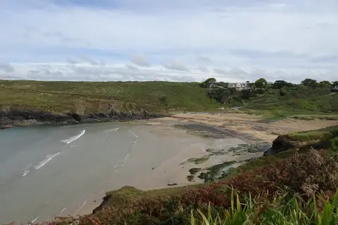 Photo of Poldhu Cove, a swimming spot near Mullion, Cornwall, south west England.