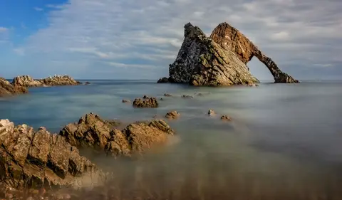 Photo of Bow Fiddle Rock, a rock formation near Portknockie, Moray, the Scottish Highlands and Islands.