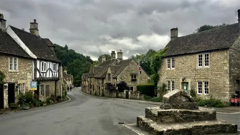 Photo of Castle Combe, a village in the Cotswolds, Wiltshire, south west England.