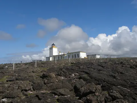 Photo of Eshaness Lighthouse, a lighthouse near Hillswick in Shetland, the Shetland Islands, the Scottish Highlands and Islands.