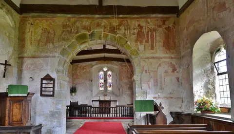 Photo of St Botolph's, Hardham, a church in the South Downs, West Sussex, south east England.
