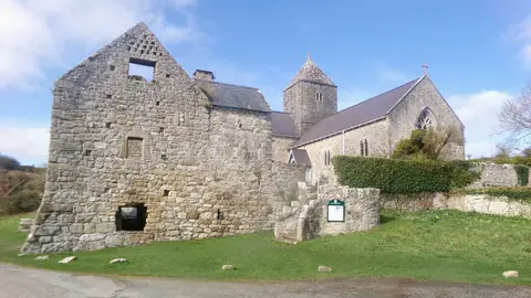 Photo of Penmon Priory, a church in Anglesey, north Wales.