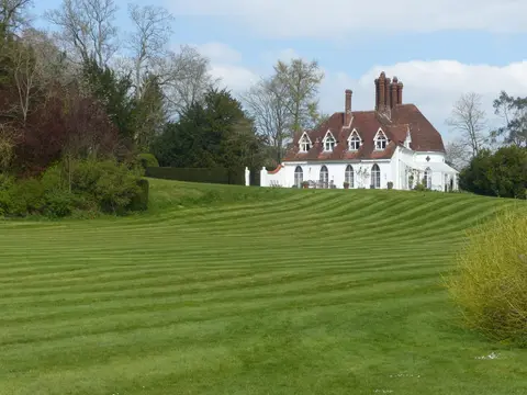 Photo of Houghton Lodge, a Grade II* registered house & garden in Hampshire, south east England.