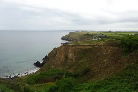 Photo of Polurrian Cove, a swimming spot near Mullion, Cornwall, south west England.