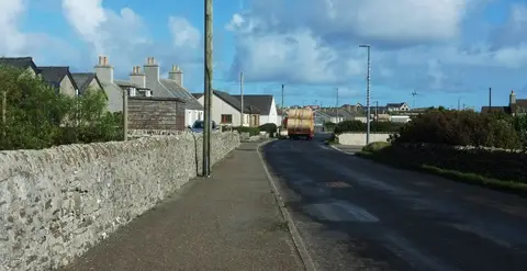 Photo of Pierowall, a village in the Orkney Islands, the Scottish Highlands and Islands.