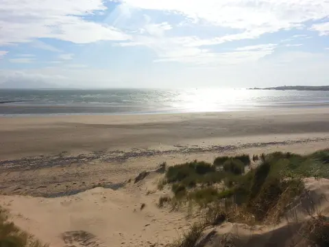 Photo of Newborough Beach, a beach in Anglesey, north Wales.