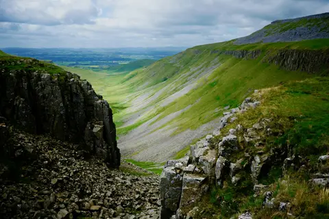 Photo of High Cup Nick, the glacial valley cut into the North Pennines escarpment, Cumbria, north west England.