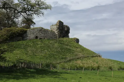 Photo of Skelbo Castle, a ruined castle near Embo, Highland, the Scottish Highlands and Islands.